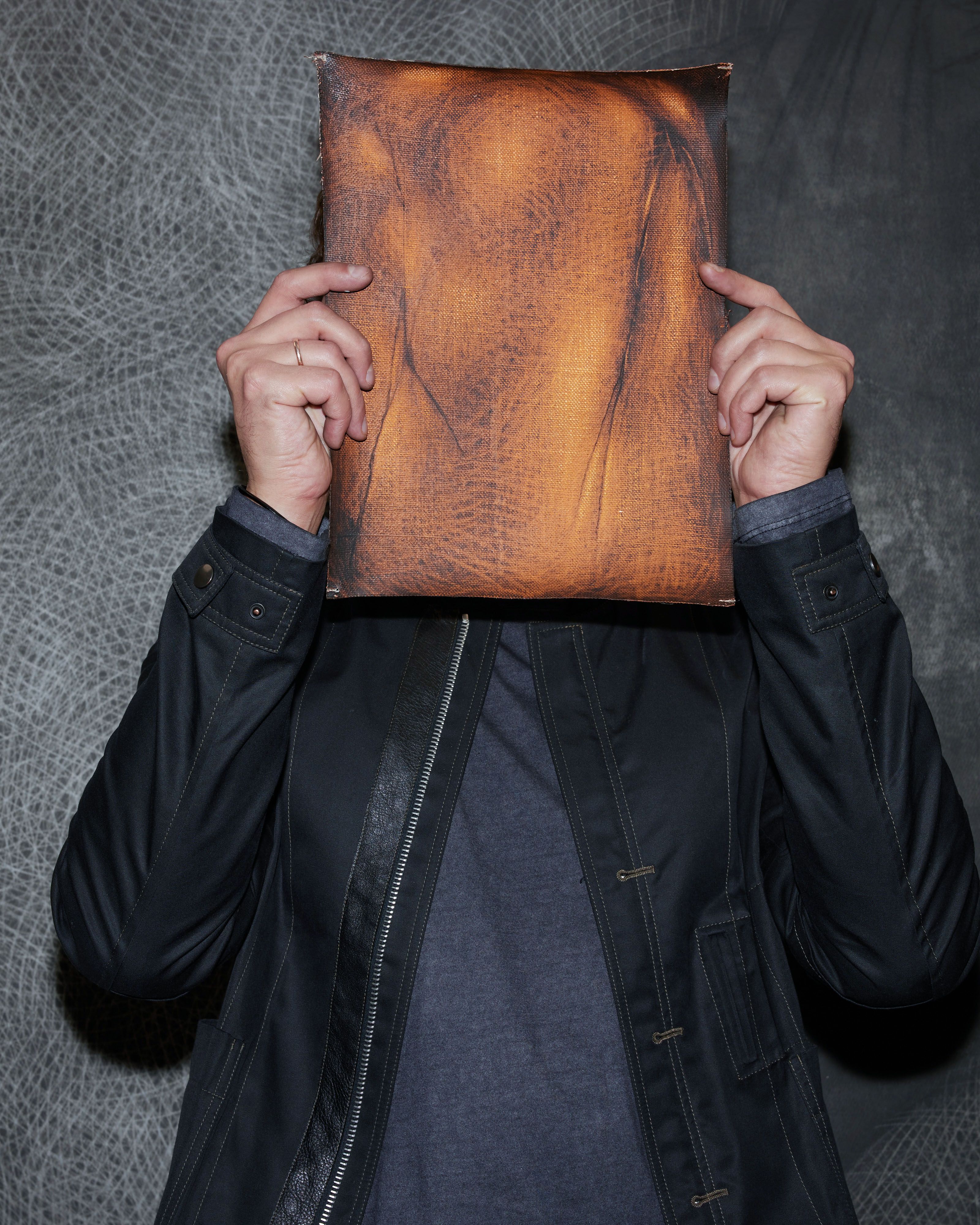 designhotel Gdansk The Cloud One portrait of Vasyl Savchenko holds a brown bag in front of his face