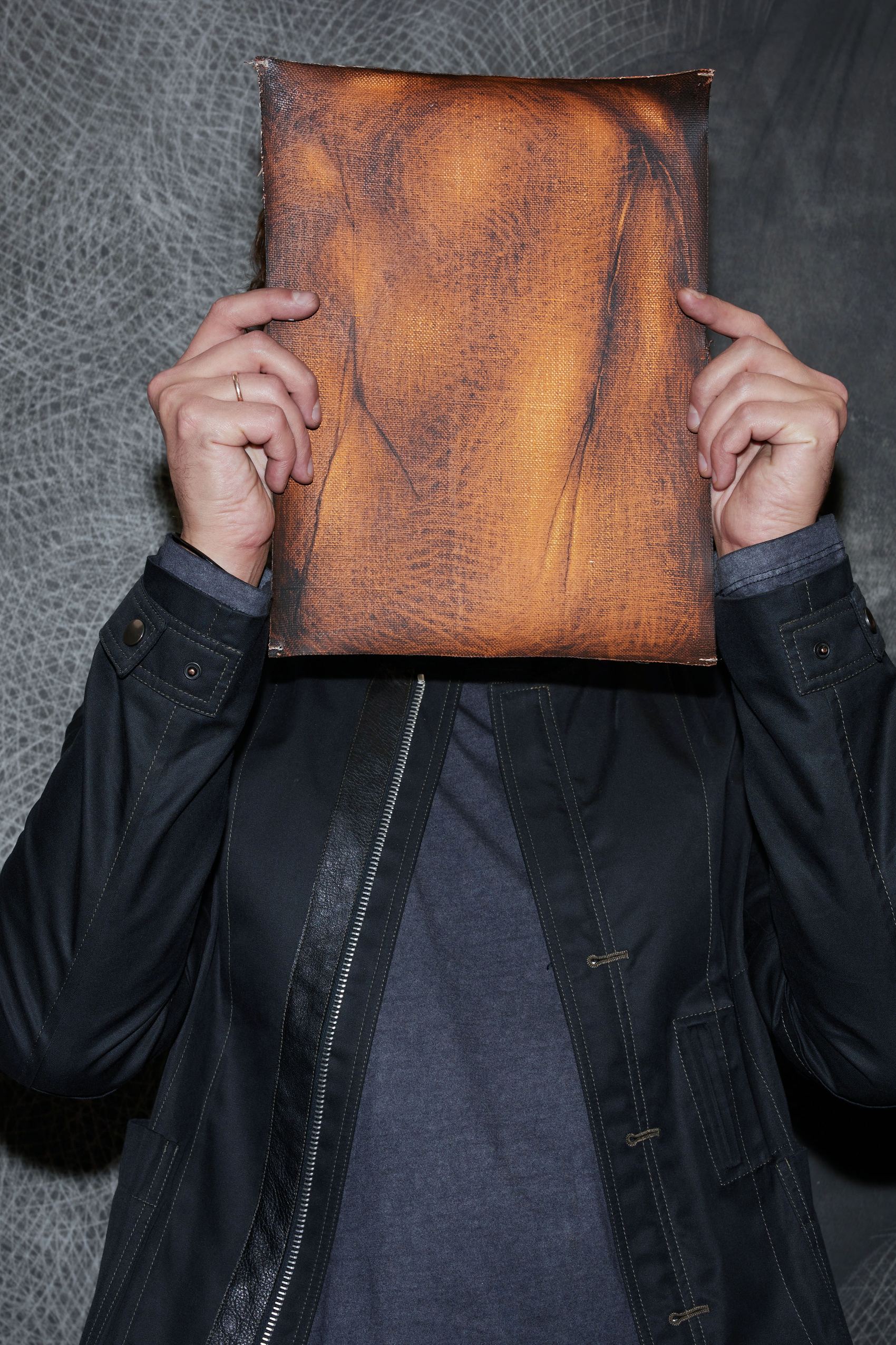 designhotel Gdansk The Cloud One portrait of Vasyl Savchenko holds a brown bag in front of his face